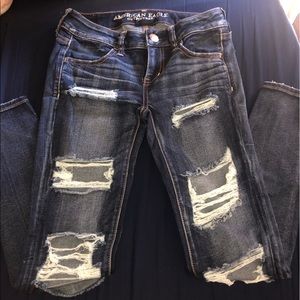 Dark blue wash distressed jeans